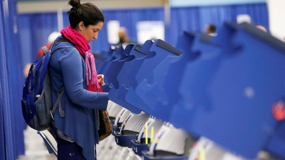 A voter casts her ballot during early voting in Chicago, Oct. 14, 2016.