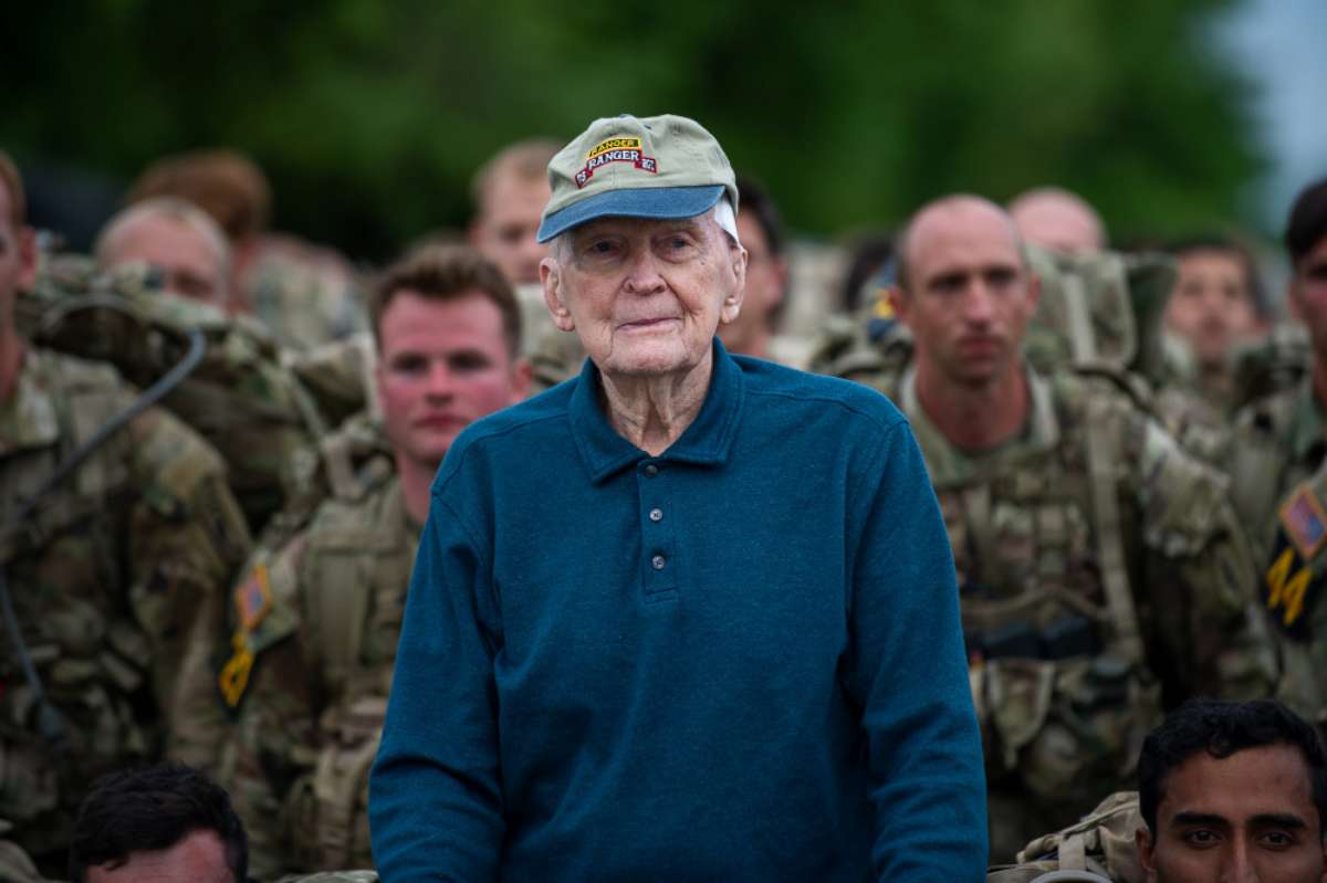 PHOTO: Retired Army Col. Ralph Puckett Jr. stands along side troops as they prepare to start a foot march during the 2021 David E. Grange Jr. Best Ranger Competition (BRC) on Fort Benning, Ga., April 16, 2021. 