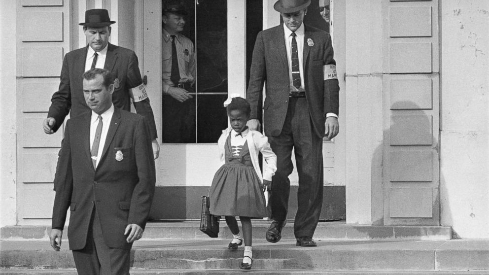 PHOTO: U.S. Deputy Marshals escort 6-year-old Ruby Bridges from William Frantz Elementary School in New Orleans, in November 1960.