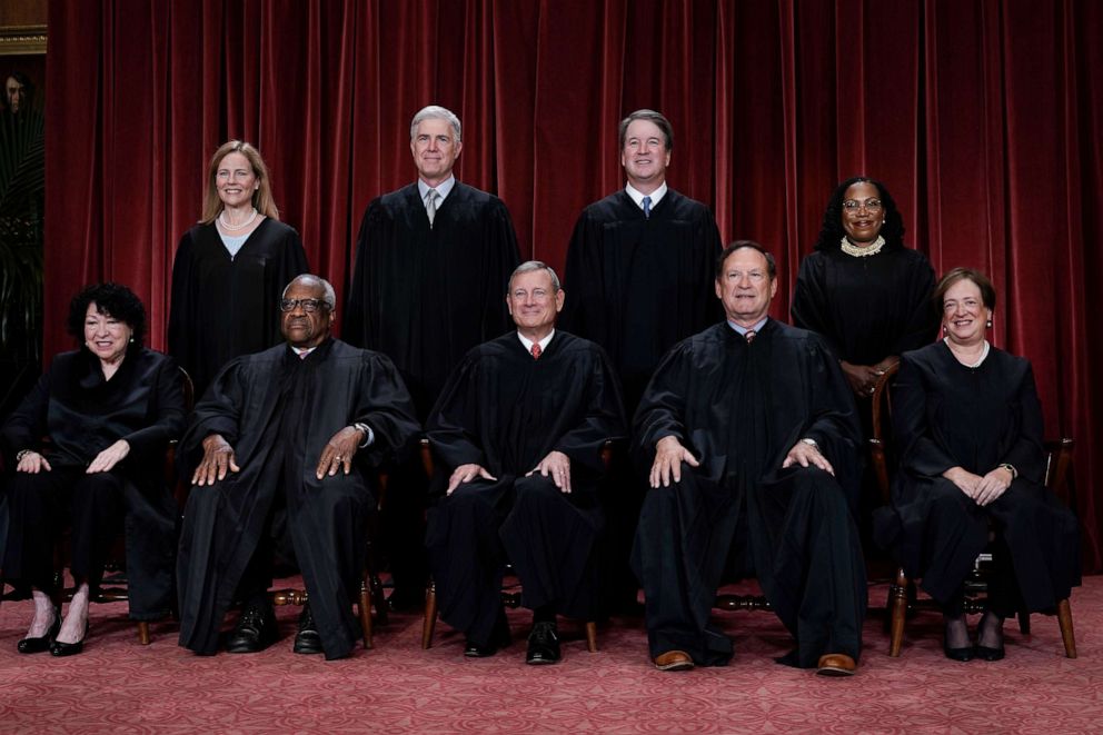 Members of the Supreme Court sit for a new group portrait following the addition of Associate Justice Ketanji Brown Jackson, at the Supreme Court building in Washington, Oct. 7, 2022.