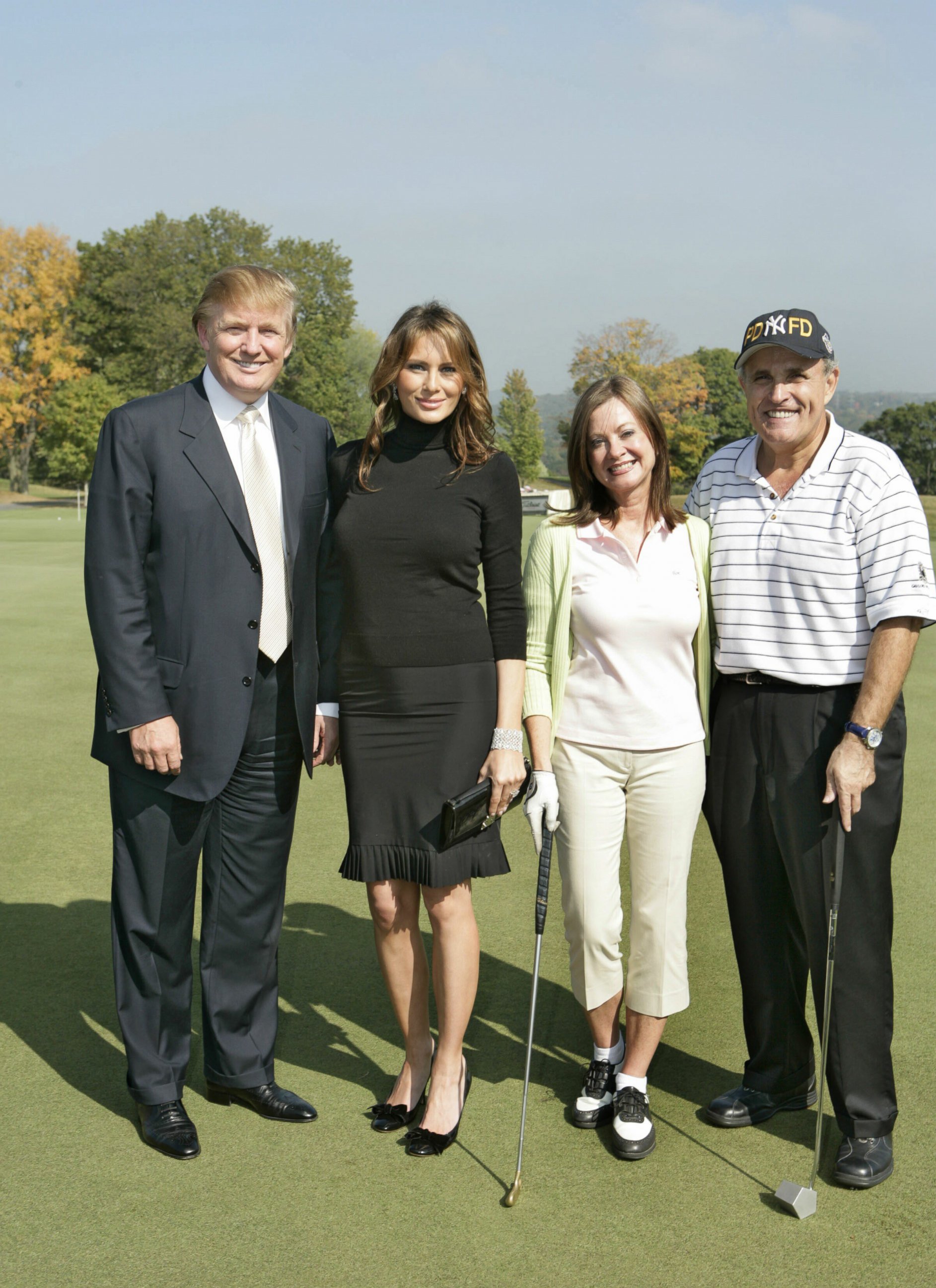PHOTO: Donald Trump, Melania Trump, Judith Giuliani and Rudy Giuliani host a charity golf tournament at the Trump National Golf Course in Westchester, New York, on Oct. 7, 2005. 