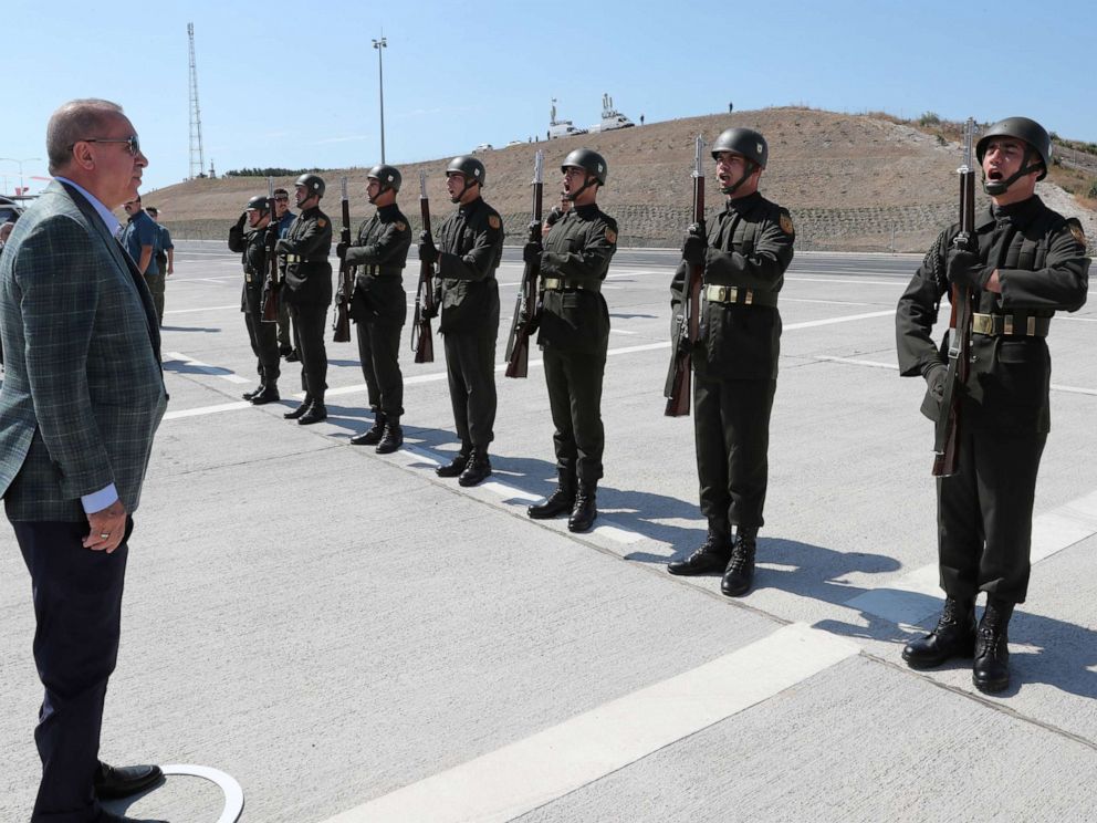 PHOTO: Turkish President Tayyip Erdogan reviews a guard of honour at the airport in Bursa, Turkey, August 4, 2019.