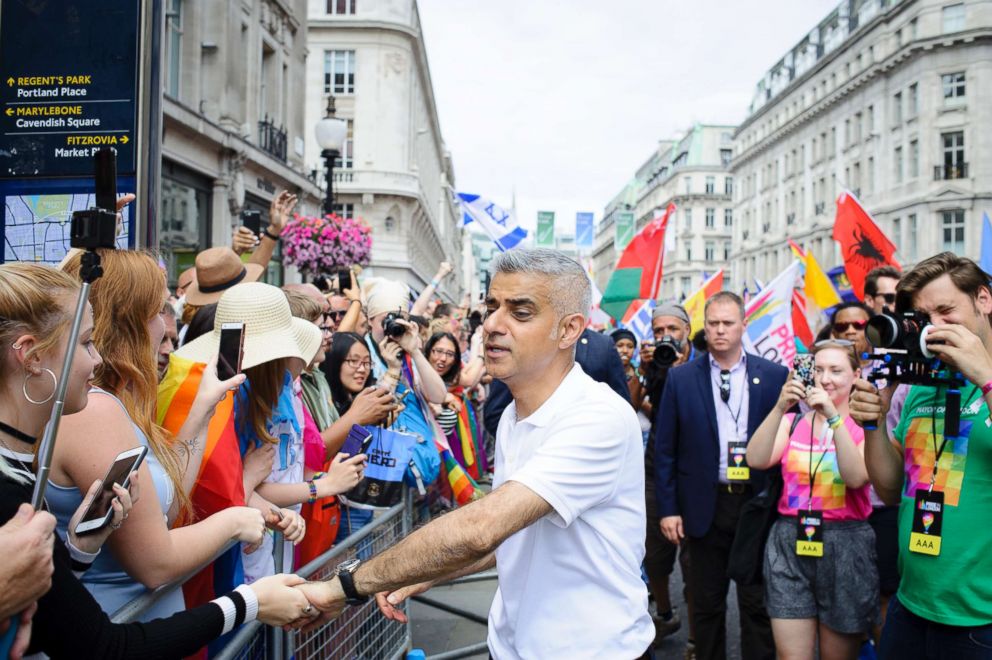 PHOTO: Mayor of London Sadiq Khan greets spectators on Regent Street at the start of the 2017 Pride in London Parade through the West End on July 8, 2017.