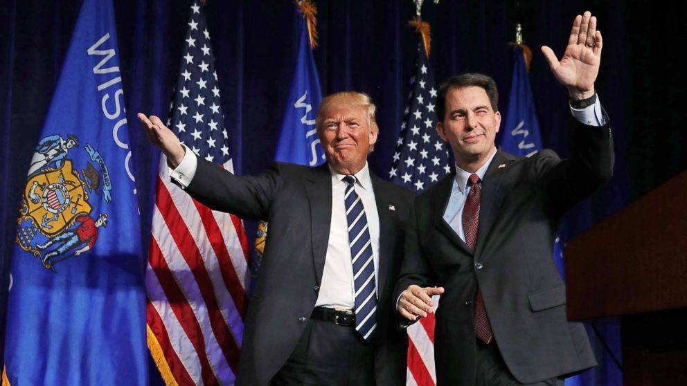 Republican presidential nominee Donald Trump is welcomed to the stage by Wisconsin Governor Scott Walker during a campaign rally at the W.L. Zorn Arena, Nov. 1, 2016 in Altoona, Wis. 