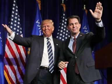 PHOTO: Republican presidential nominee Donald Trump is welcomed to the stage by Wisconsin Governor Scott Walker during a campaign rally at the W.L. Zorn Arena, Nov. 1, 2016 in Altoona, Wisc.