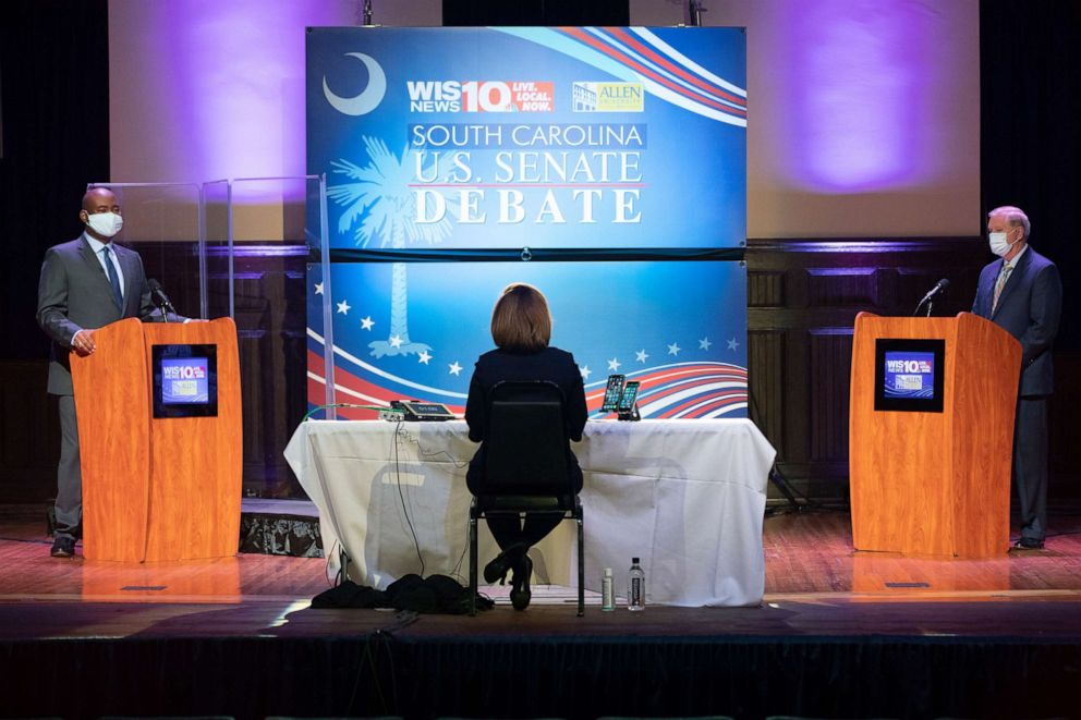 PHOTO: Jaime Harrison, left, and Sen. Lindsey Graham, right, face off in the South Carolina Senate debate at Allen University in Columbia, S.C., Oct. 3, 2020. 