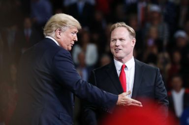 PHOTO: President Donald Trump, left, talks with Republican candidate for Kansas 2nd Congressional District Steve Watkins during a campaign rally at Kansas Expocentre, Oct. 6, 2018 in Topeka, Kan.