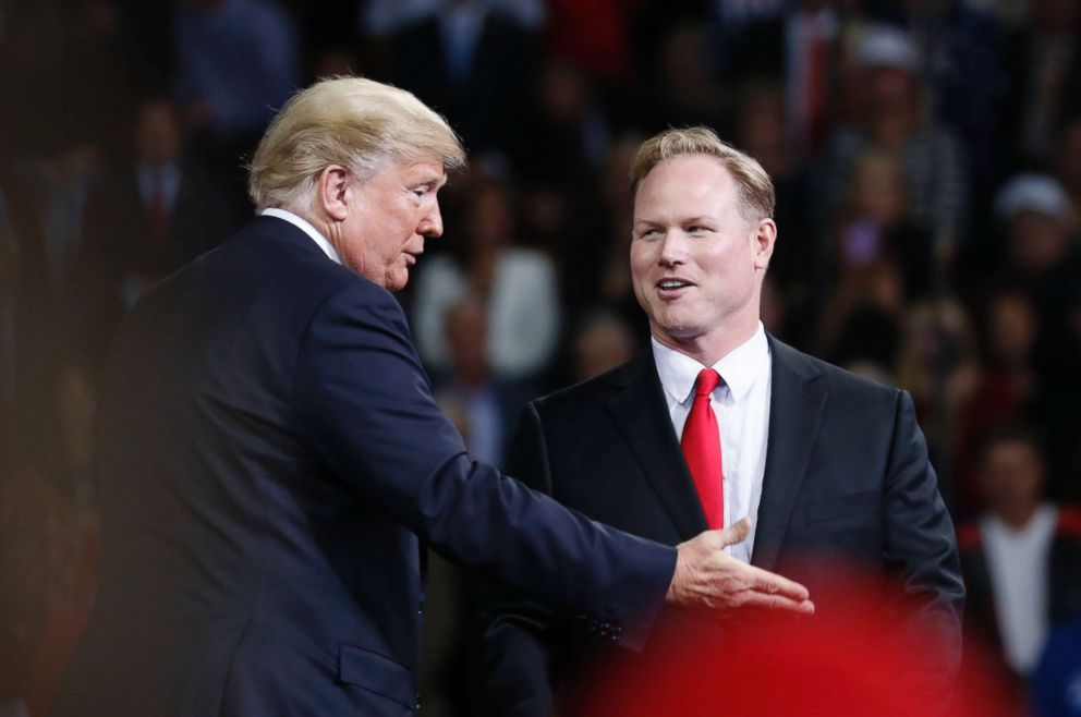 PHOTO: President Donald Trump, left, talks with Republican candidate for Kansas' 2nd Congressional District Steve Watkins during a campaign rally at Kansas Expocentre, Oct. 6, 2018 in Topeka, Kan.