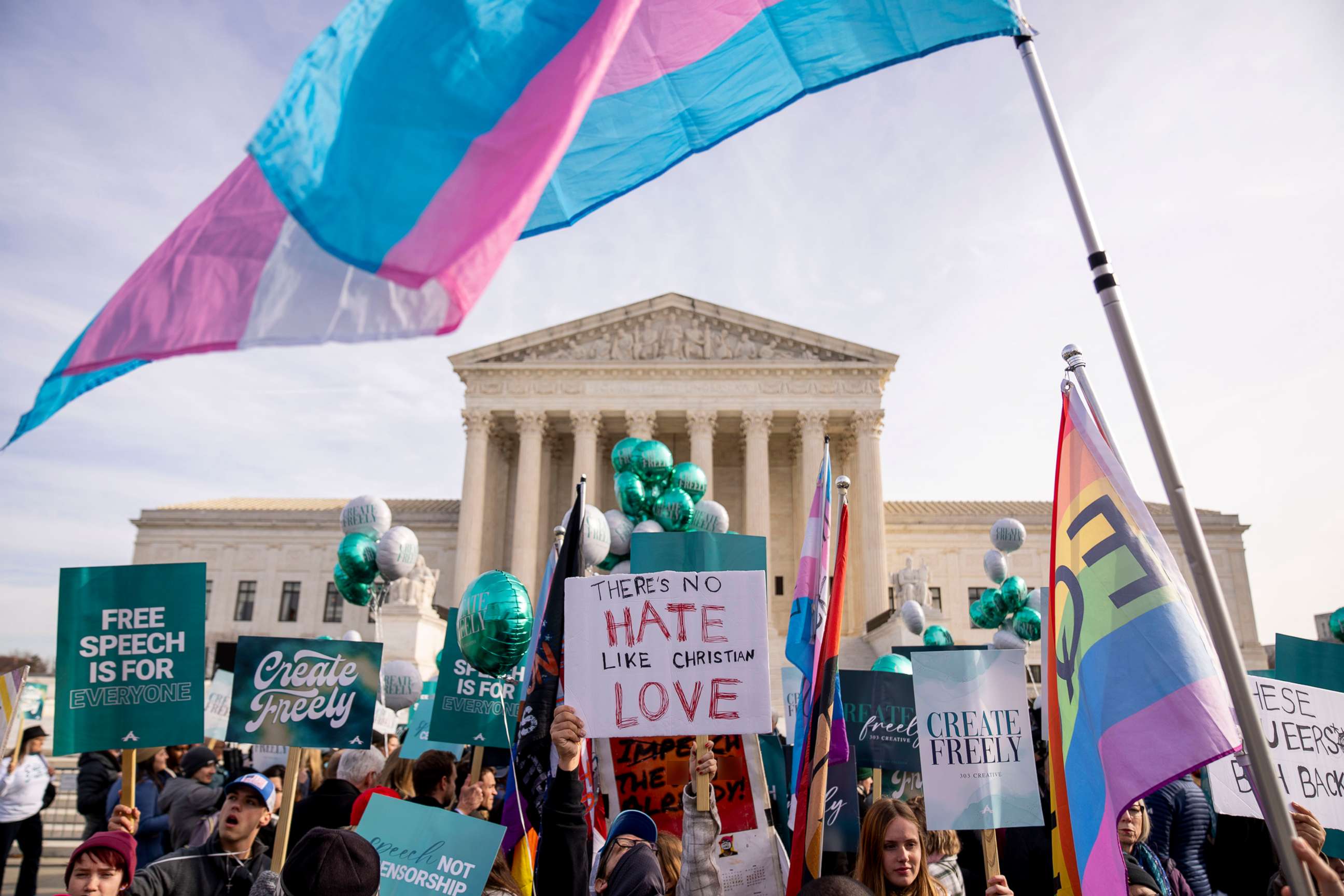 PHOTO: A person holds a sign that reads "There's No Hate Like Christian Love" as people on both sides of a debate rally outside the Supreme Court, Dec. 5, 2022. 