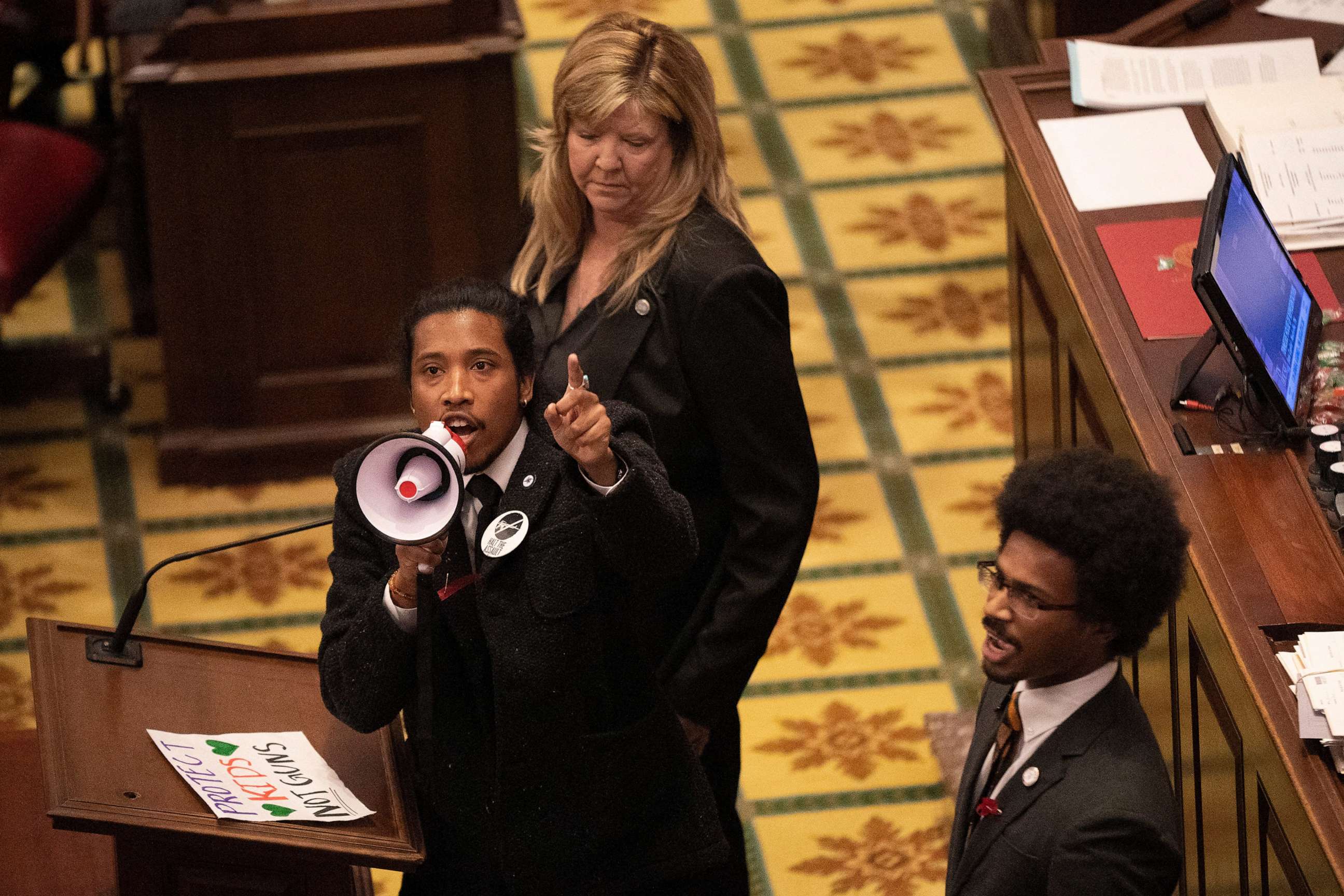 PHOTO: Tennessee State Representative Justin Jones, Rep. Justin Pearson and Rep. Gloria Johnson, call on their colleagues to pass gun control legislation from the well of the House Chambers at the State Capitol, March 30, 2023, in Nashville, Tenn.