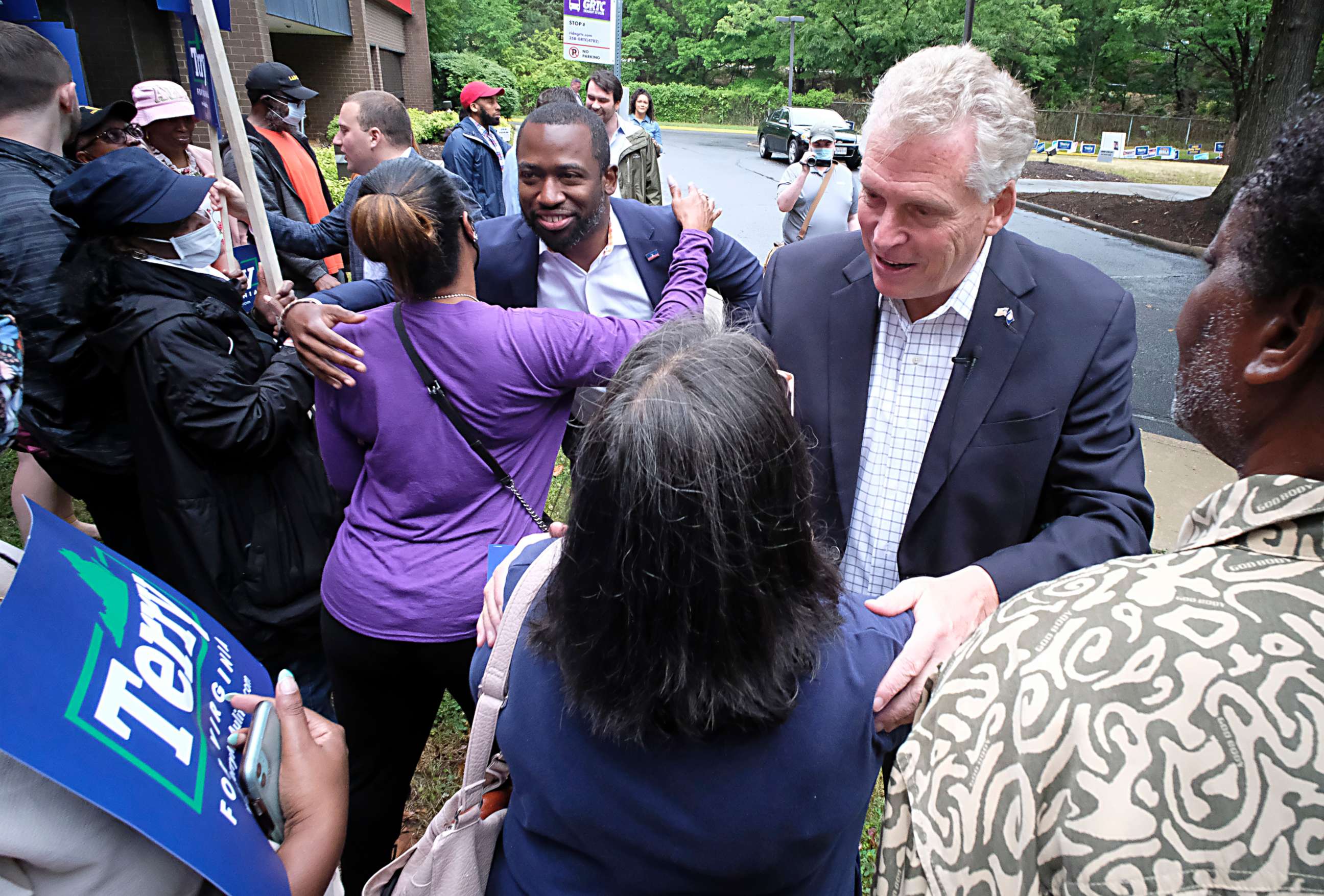 PHOTO: Former Virginia Gov. Terry McAuliffe, right, and Richmond Mayor Levar Stoney, left, greet McAuliffe supporters during a quick rally outside the Office of the General Registrar, in Richmond, Virginia, on  Friday, June 4, 2021.