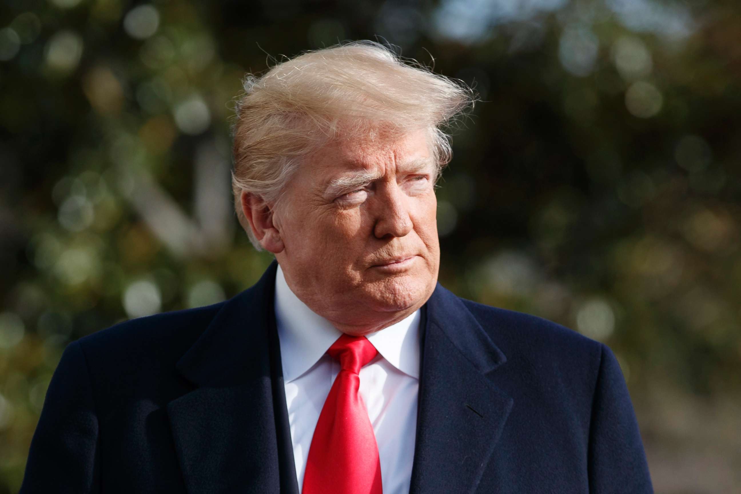 PHOTO: President Donald Trump walks to speak to the media before boarding Marine One on the South Lawn of the White House, Dec. 8, 2018. 