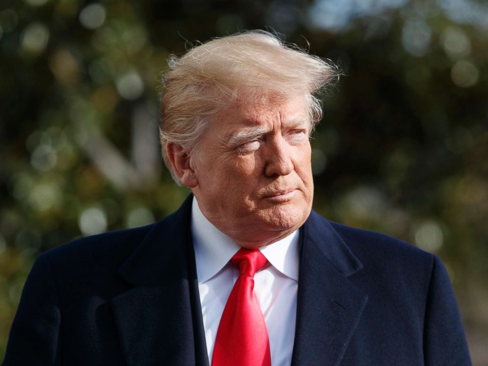 PHOTO: President Donald Trump walks to speak to the media before boarding Marine One on the South Lawn of the White House, Dec. 8, 2018.