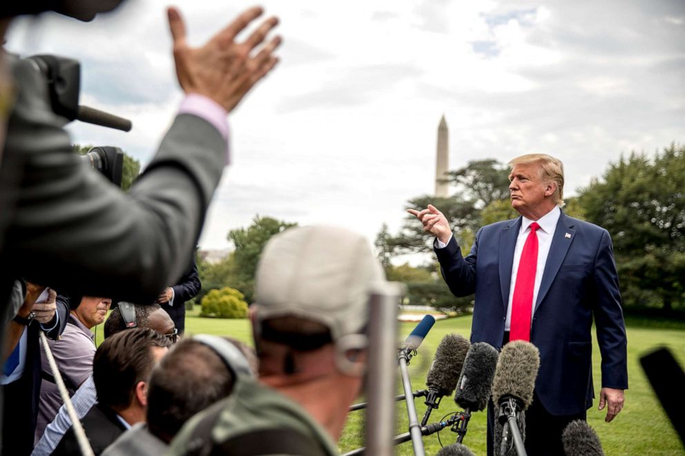 PHOTO: President Donald Trump takes a question from a reporter on the South Lawn of the White House, Sept. 9, 2019, before boarding Marine One for a short trip to Andrews Air Force Base, Md.