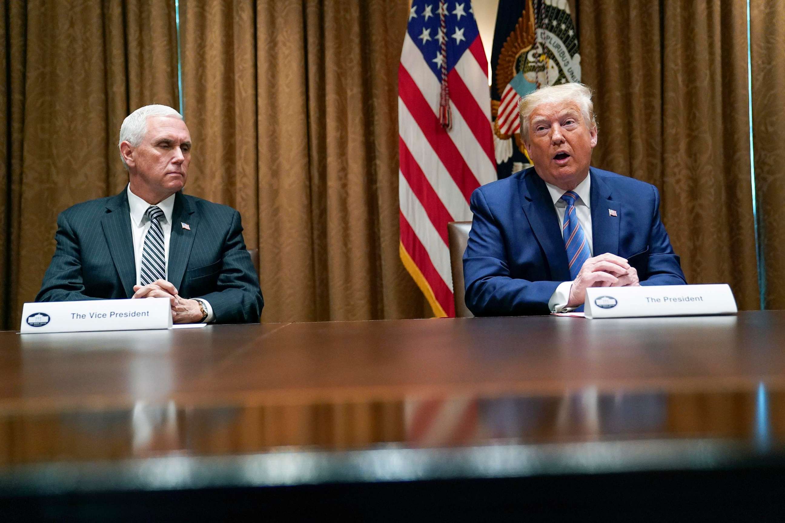 PHOTO: President Donald Trump speaks during a roundtable about America's seniors, in the Cabinet Room of the White House, June 15, 2020, as Vice President Mike Pence listens. 