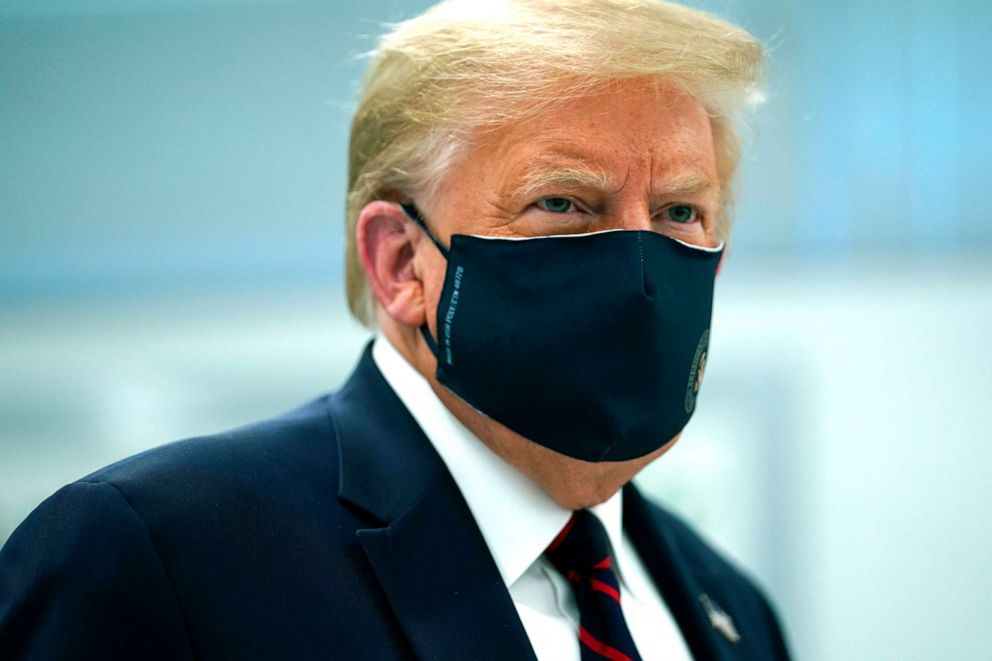 PHOTO: President Donald Trump wears a face mask as he participates in a tour of Bioprocess Innovation Center at Fujifilm Diosynth Biotechnologies, July 27, 2020, in Morrisville, N.C. 