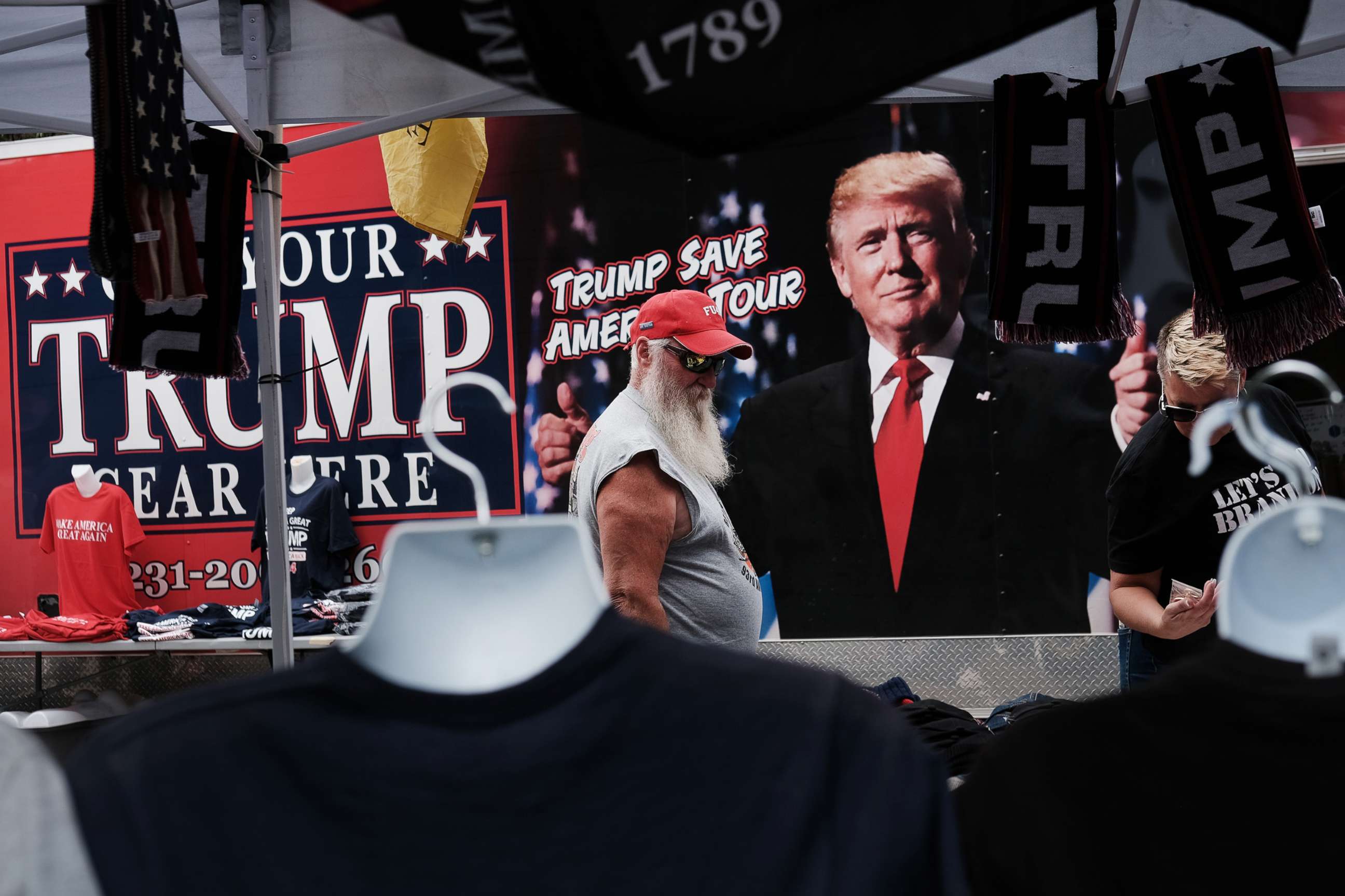 PHOTO: Merchandise is available for sale as people gather to hear former president Donald Trump speak as he endorses local candidates at the Mohegan Sun Arena, Sept. 3, 2022, in Wilkes-Barre, Pa. 