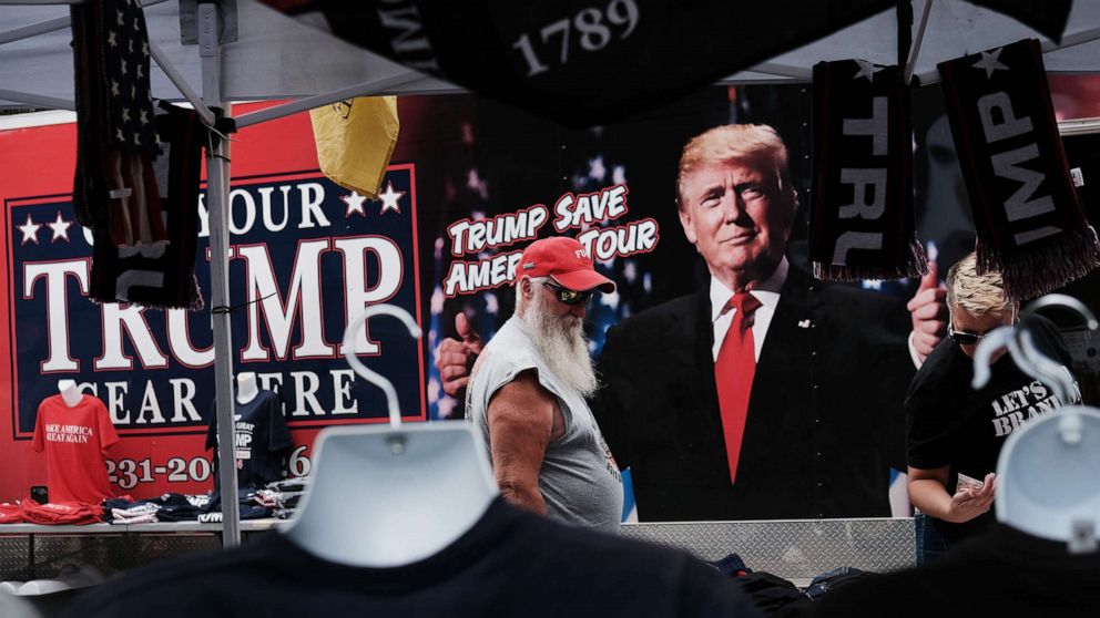 PHOTO: Merchandise is available for sale as people gather to hear former president Donald Trump speak as he endorses local candidates at the Mohegan Sun Arena, Sept. 3, 2022, in Wilkes-Barre, Pa. 