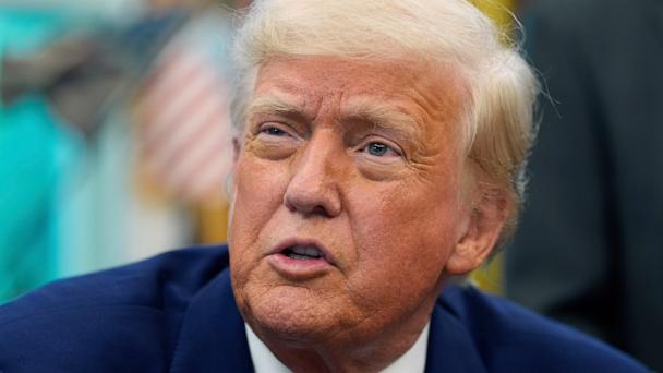 President Donald Trump speaks with reporters as he signs an executive order in the Oval Office of the White House, May 9, 2025.