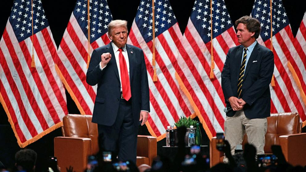 PHOTO: Former President and Republican presidential candidate Donald Trump arrives for a live interview with Tucker Carlson during the finale of the Tucker Carlson Live Tour at Desert Diamond Arena in Glendale, Ariz., Oct. 31, 2024. 