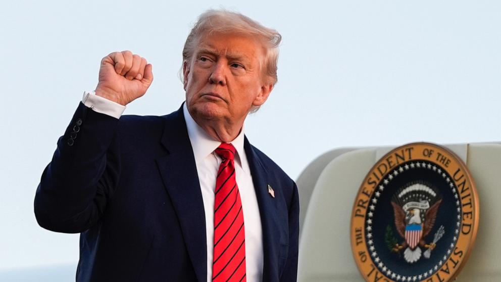 PHOTO: President Donald Trump signals while boarding Air Force One at Lehigh Valley International Airport, Sunday, Aug. 3, 2025, in Allentown, Pa.