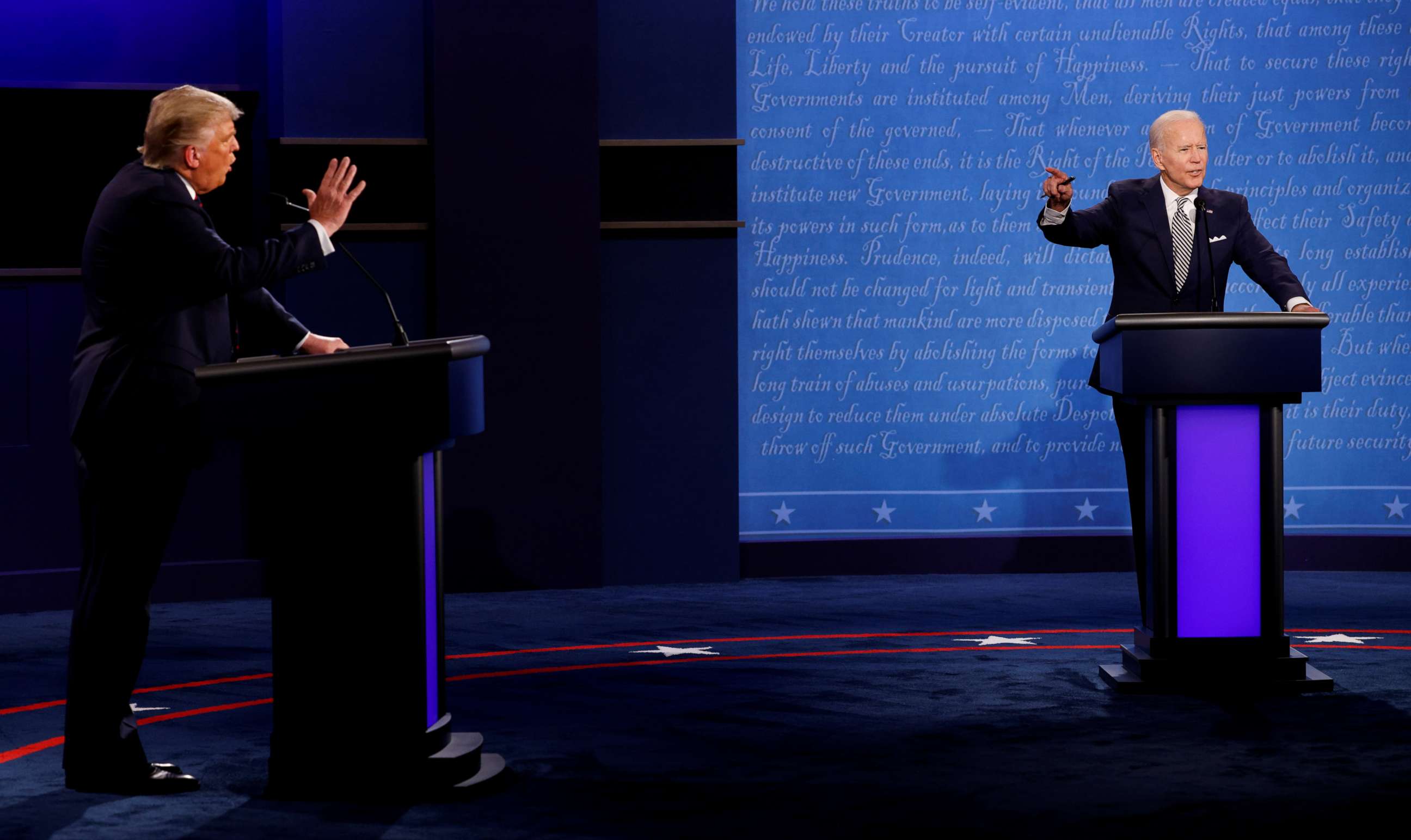FILE PHOTO: U.S. President Donald Trump and Democratic presidential nominee Joe Biden participate in their first 2020 presidential debate held on the campus of the Cleveland Clinic at Case Western Reserve University in Cleveland, September 29, 2020. 