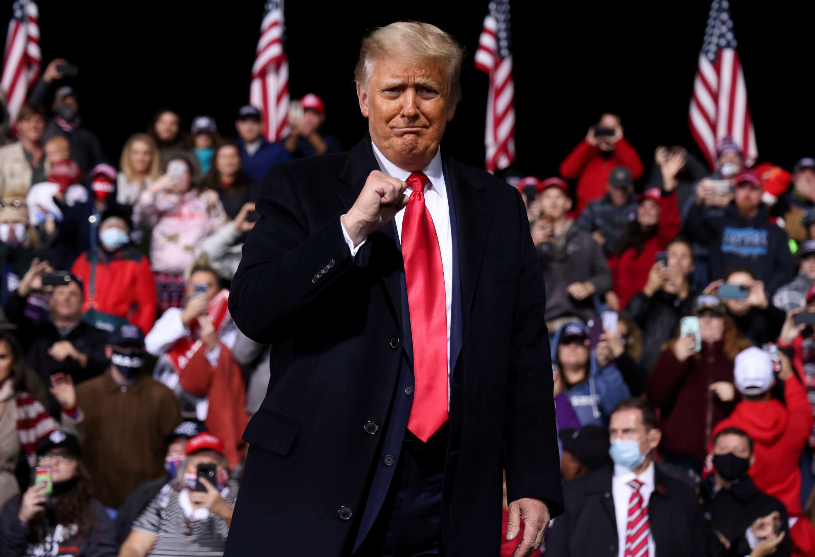 FILE PHOTO: U.S. President Donald Trump gestures as he leaves after a campaign event for Republican U.S. senators David Perdue and Kelly Loeffler in Valdosta, Georgia, U.S., December 5, 2020.