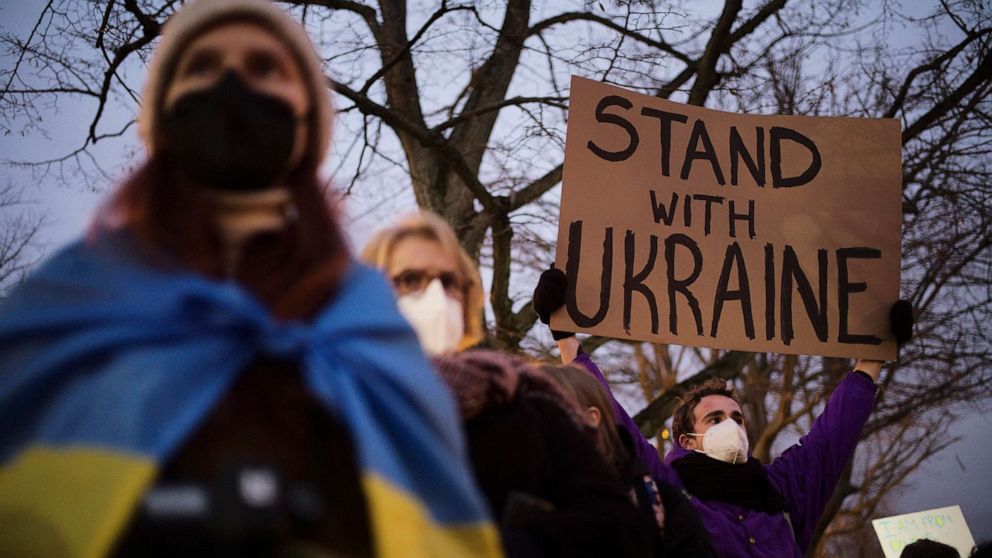 PHOTO: A man holds a poster in support of Ukraine as he attends a demonstration near the Russian embassy to protest against the escalation of the tension between Russia and Ukraine in Berlin, Feb. 22, 2022.