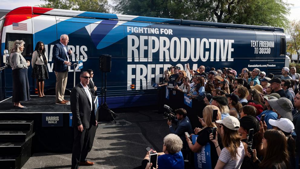 PHOTO: Democratic vice presidential nominee Tim Walz addresses the crowd at a Harris-Walz campaign's "Fighting for Reproductive Freedom" bus tour stop and canvass kick-off event outside their Henderson campaign office in Henderson, Nev., Oct. 27, 2024. 