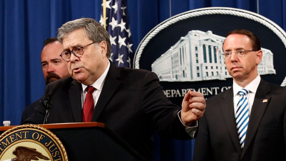 Attorney General William Barr speaks alongside Deputy Attorney General Rod Rosenstein, right, and acting Principal Associate Deputy Attorney General Edward O'Callaghan, left, about the release of a redacted version of special counsel Robert Mueller's