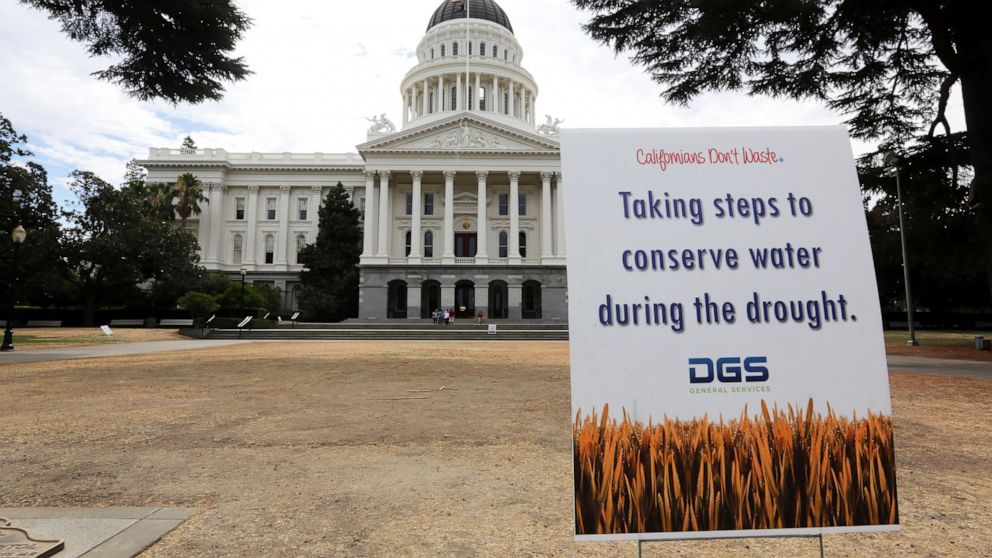 FILE - In this July 8, 2014, file photo, is a sign alerting visitors to water conservation efforts at the state Capitol in Sacramento, Calif. Gov. Gavin Newsom has declared an emergency executive order in two Northern California counties in response 