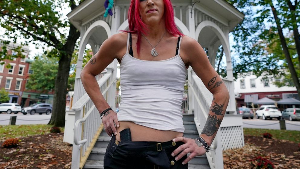 Aria DiMezzo, a Republican candidate for sheriff in Cheshire County, New Hampshire, poses at the Central Square gazebo, Tuesday, Oct. 6, 2020, in Keene, N.H. Republicans in the New Hampshire county are wrestling with the fact that DiMezzo, who was no