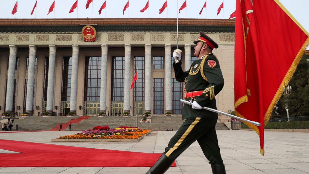 FILE - In this Nov. 9, 2017, file photo, a member of the Chinese military marches before the welcoming ceremony for President Donald Trump and Chinese President Xi Jinping at the Great Hall of the People, in Beijing, China. A new defense intelligence