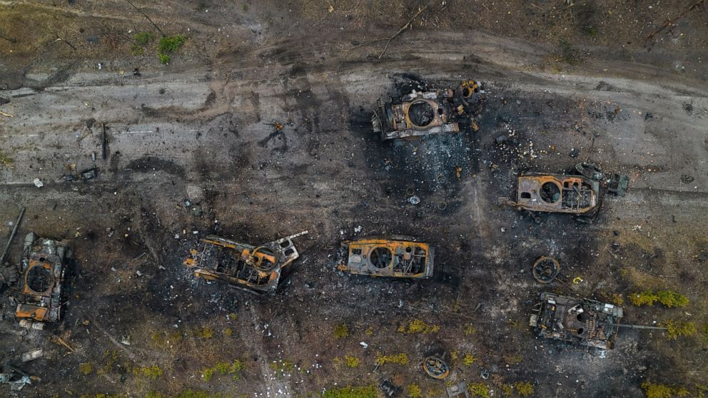 FILE - Destroyed Russian armored vehicles sit on the outskirts of Kyiv, Ukraine, March 31, 2022. Disinformation about Russia's invasion of Ukraine is surging in Spanish, as content crafted for a Latin American audience gets a boost from the Kremlin. 