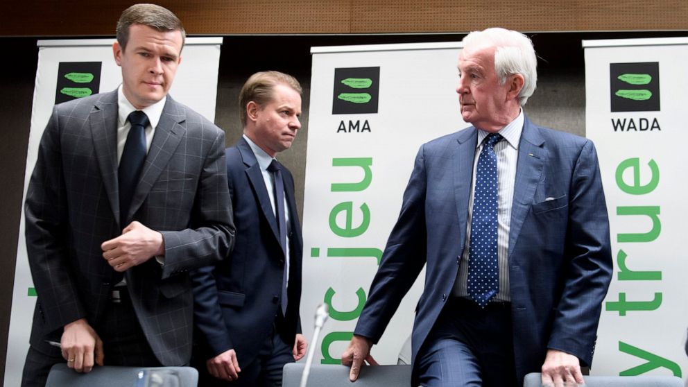 President-Elect of World Anti-Doping Agency (WADA) Witold Banka, left, President of World Anti-Doping Agency (WADA) Craig Reedie, right, and Director General of World Anti-Doping Agency (WADA) Olivier Niggli, center, arrive for a press conference aft