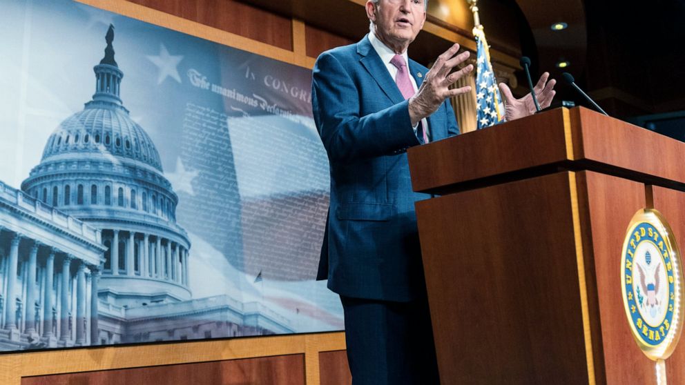 Manchin wavers on Biden's plan, rebuffs progressives