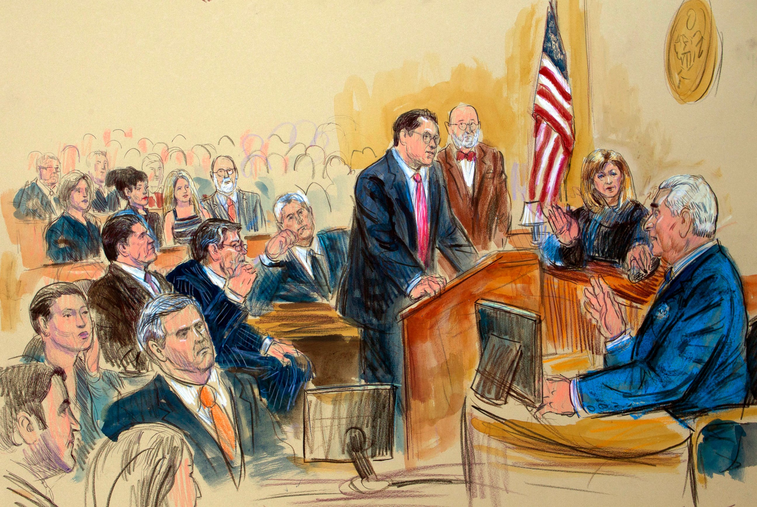 This courtroom sketch shows former campaign adviser for President Donald Trump, Roger Stone talking from the witness stand as prosecution attorney Jonathan Kravis, standing left, Stone's attorney Bruce Rogow, third from right, and Judge Amy Berman Ja