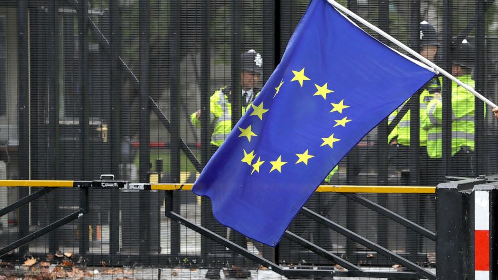 A European Union flag is flown in front of entrance gates to Parliament in London, Monday, Sept. 9, 2019. British Prime Minister Boris Johnson voiced optimism Monday that a new Brexit deal can be reached so Britain leaves the European Union by Oct. 3