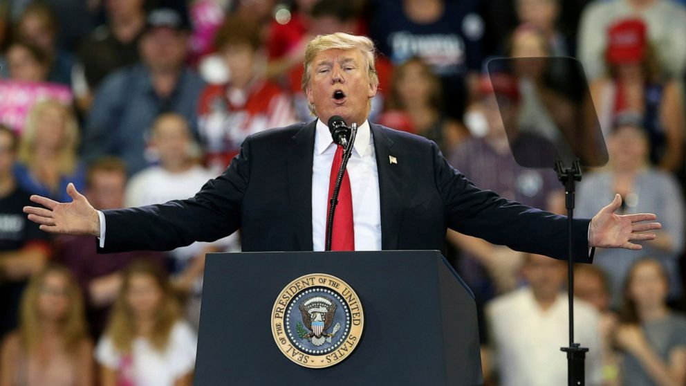 FILE - In this June 20, 2018 file photo, U.S. President Donald Trump speaks at a campaign rally in Duluth, Minn. Trump heads back to Minnesota on the nation's tax filing deadline, Monday, April 15, 2019, eager to remind voters in a state he nearly carried in 2016 about the $1.5 trillion Republican tax cut. It's a policy achievement that won't resonate with everyone in Minnesota, where the loss of the state tax deduction hurt some taxpayers. And national polls show most Americans don't have a clear idea what the tax cuts did for them. (AP Photo/Jim Mone File)