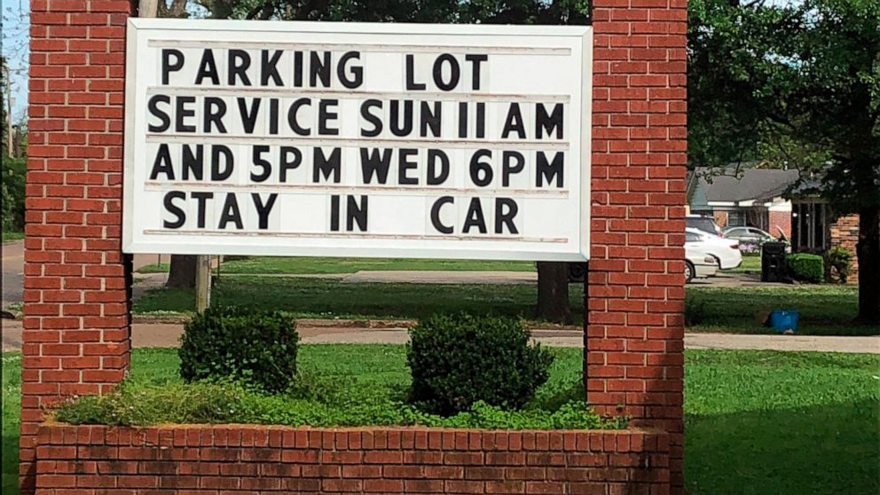 This image provided by Alliance Defending Freedom shows the sign for parking lot church services outside of Temple Baptist Church in Greenville, Miss., on April 9, 2020. The Justice Department has weighed in on a local Mississippi case involving a ch