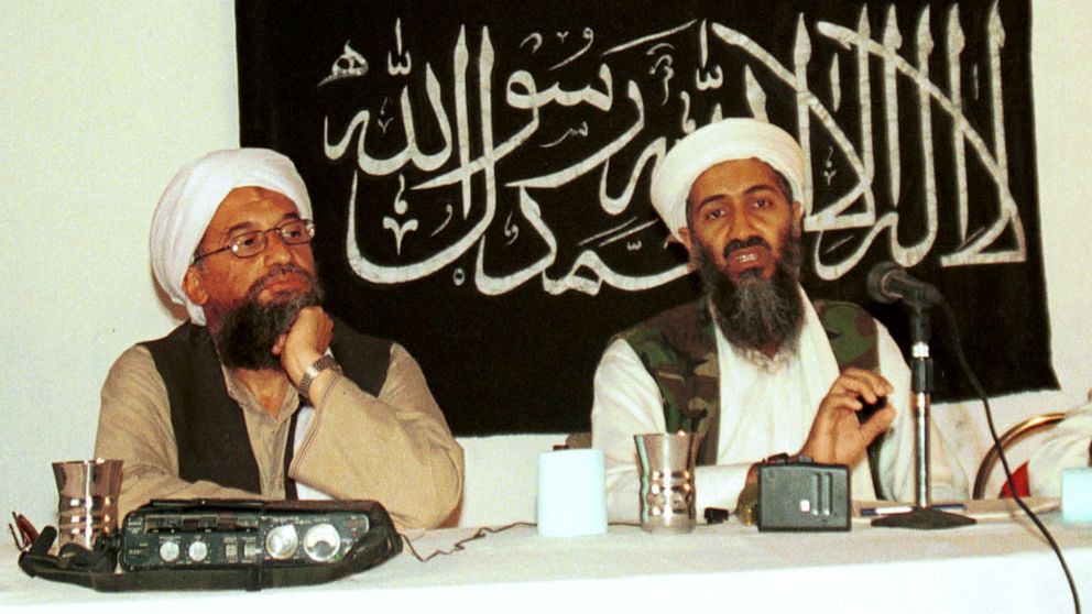 FILE - In this 1998 file photo made available Friday, March 19, 2004, Ayman al-Zawahri, left, listens during a news conference with Osama bin Laden in Khost, Afghanistan. A U.S. airstrike has killed al-Qaida leader Ayman al-Zawahri in Afghanistan, ac