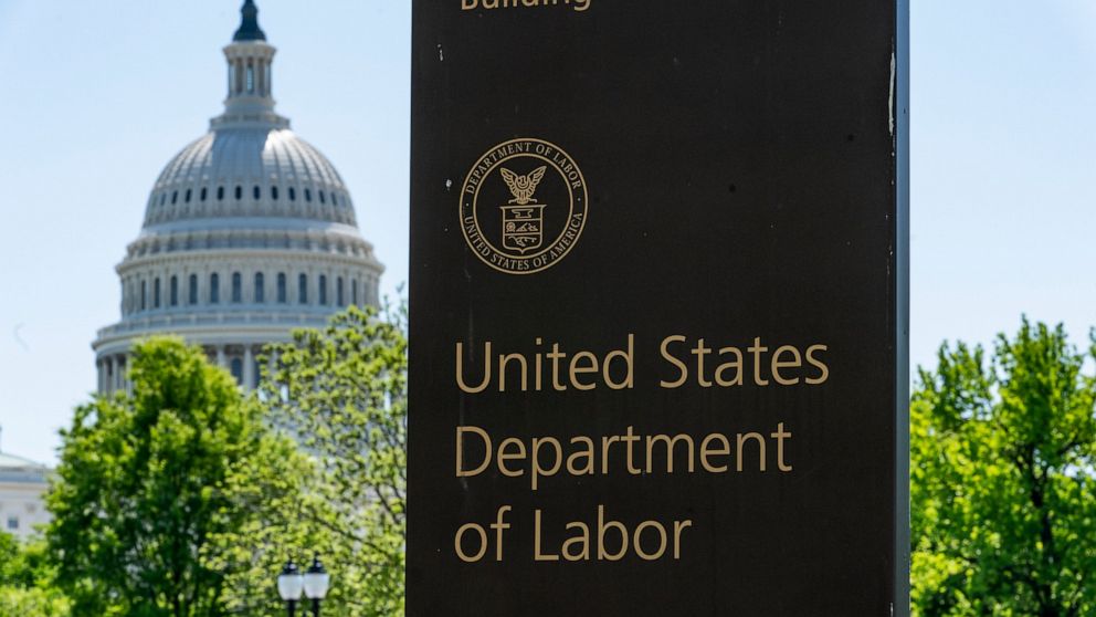 In this May 7, 2020, photo, the entrance to the Labor Department is seen near the Capitol in Washington. The record unemployment rate reflects a nation ravaged by the coronavirus pandemic, the economic devastation upending the presidential campaign a