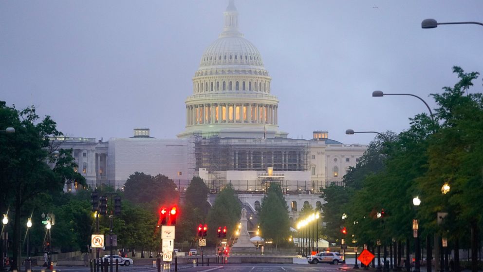 Morning fog begins to lift around the US Capitol in Washington, Saturday, May 14, 2022. (Photo/Pablo Martinez Monsivais)