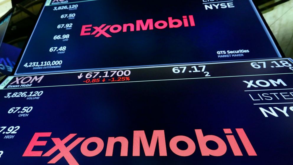 FILE - The logo for ExxonMobil appears above a trading post on the floor of the New York Stock Exchange, Oct. 8, 2019. Massachusetts' highest court on Tuesday, May 24, 2022, rejected a bid by ExxonMobil to dismiss a lawsuit brought by the state that 