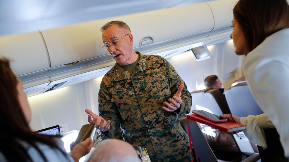 Joint Chiefs Chairman Gen. Joseph Dunford gestures while speaking to reporters during a briefing on a military aircraft before arrival at El Paso International airport, Saturday, Feb. 23, 2019. Dunford is traveling with Acting Secretary of Defense Pa
