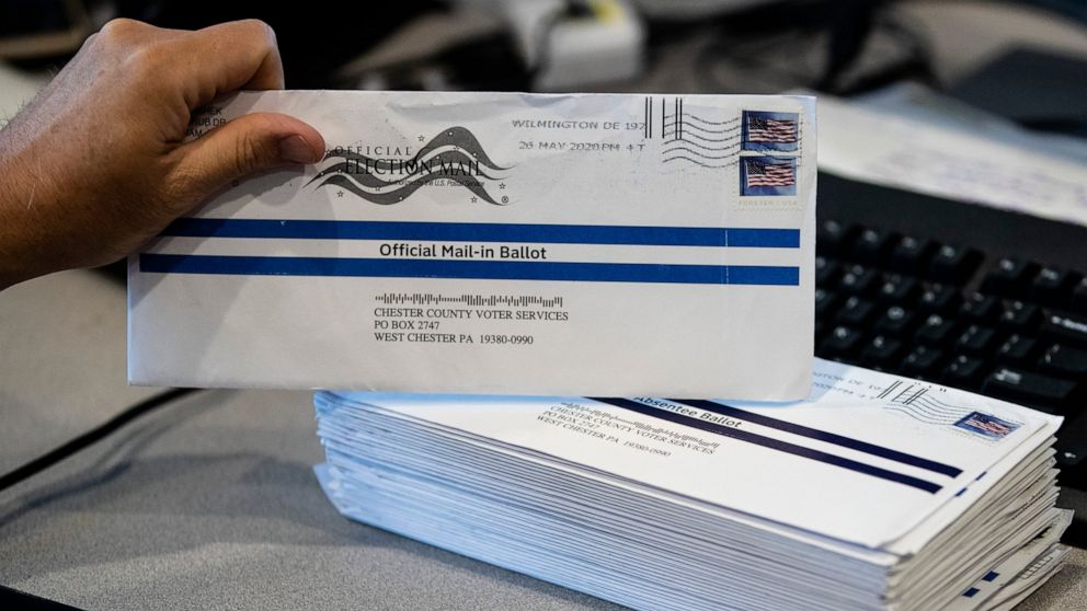FILE - In this May 28, 2020, file photo, mail-in primary election ballots are processed at the Chester County Voter Services office in West Chester, Pa. Gov. Tom Wolf's top election official said Friday, Aug. 14, that the administration had to take a