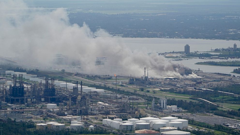 FILE - A chemical fire burns at a facility during the aftermath of Hurricane Laura, Aug. 27, 2020, near Lake Charles, La. The Securities and Exchange Commission moved closer Friday, June 17, 2022, to a final rule that would dramatically change what p