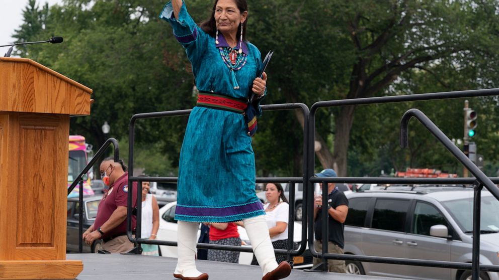 FILE - Interior Secretary Deb Haaland waves after speaking to a crowd during a totem pole delivery ceremony by Native American tribal leaders and Indigenous activists, on Capitol Hill in Washington on July 29, 2021. Secretary Haaland vowed on her fir
