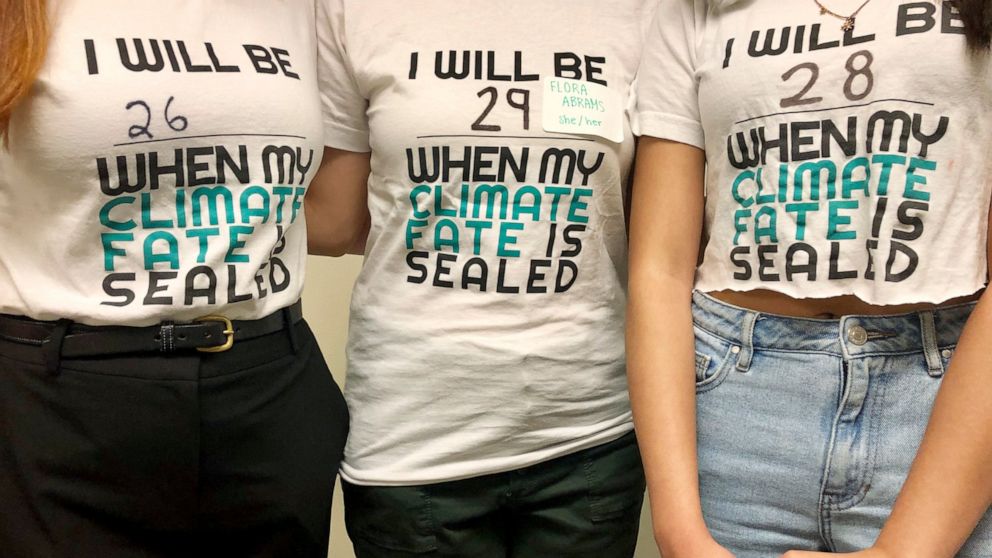 Student leaders with the lobbying group Renew Oregon, which helped craft landmark climate change legislation currently under debate in Oregon, pose to show their T-shirts after a news conference in Salem, Oregon, on June 20, 2019. Minority Republican