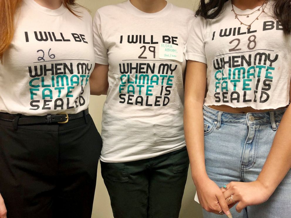 Student leaders with the lobbying group Renew Oregon, which helped craft landmark climate change legislation currently under debate in Oregon, pose to show their T-shirts after a news conference in Salem, Oregon, on June 20, 2019. Minority Republican